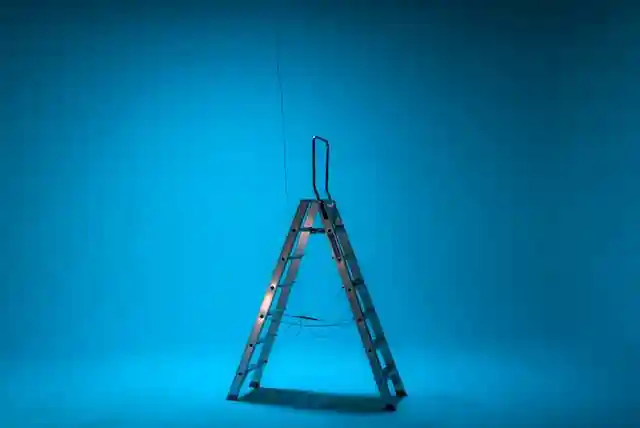 Ladder in the middle of a blue room