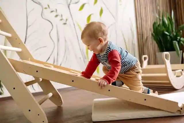 Little kid playing with ladders