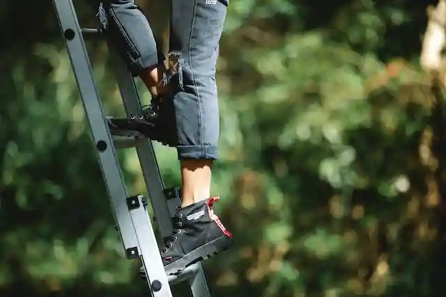 Person climbing a ladder